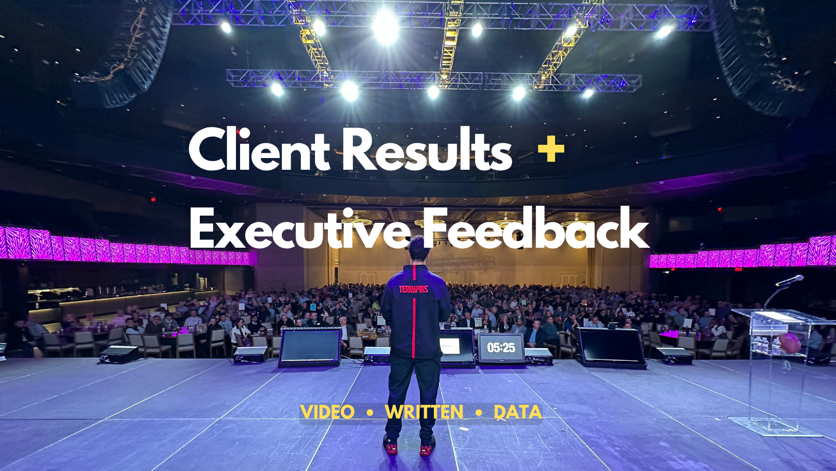 David Holloway delivering a keynote to a large audience at a corporate event