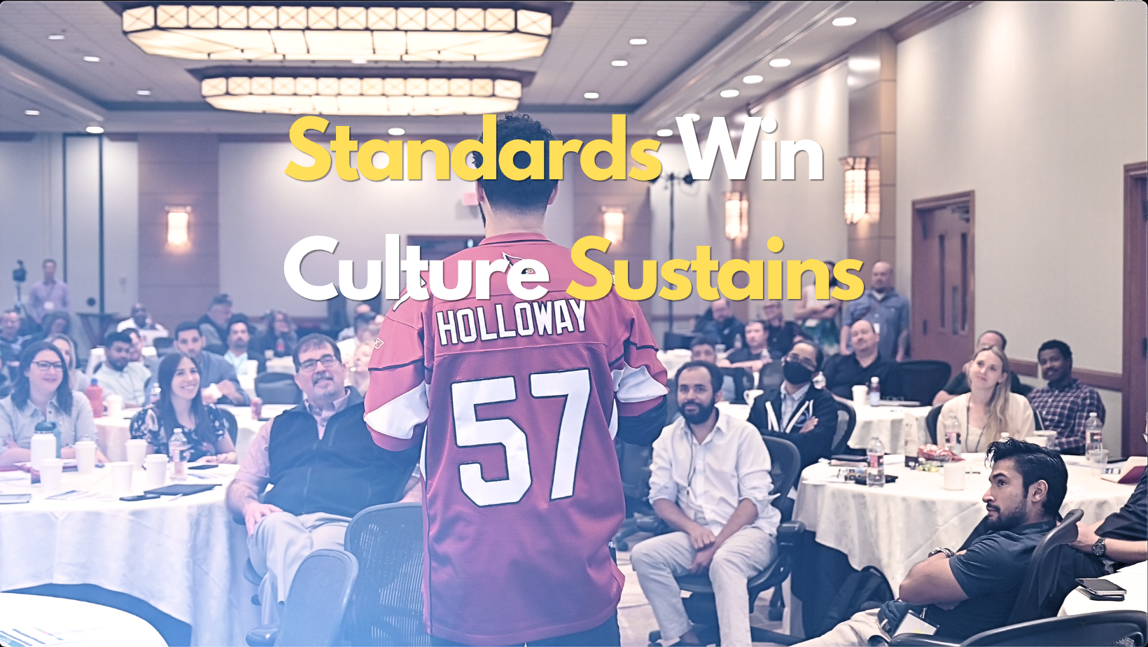 David Holloway delivers a speech during a leadership team building retreat